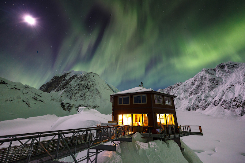 The Sheldon Chalet with the aurora borealis in the background