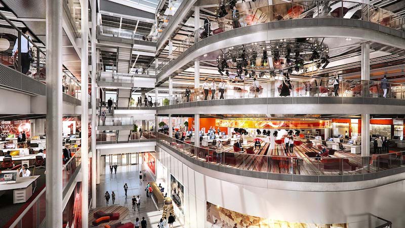 Work spaces and amenities overlooking the full-height atrium in the BBC Wales HQ