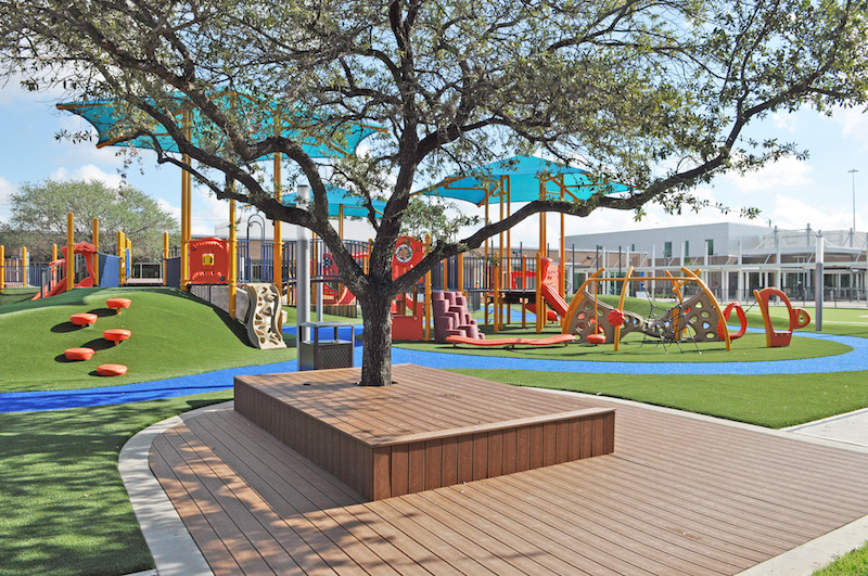 ​View from classrooms (Building A) to learning platforms and play area at the Awty International School in Houston